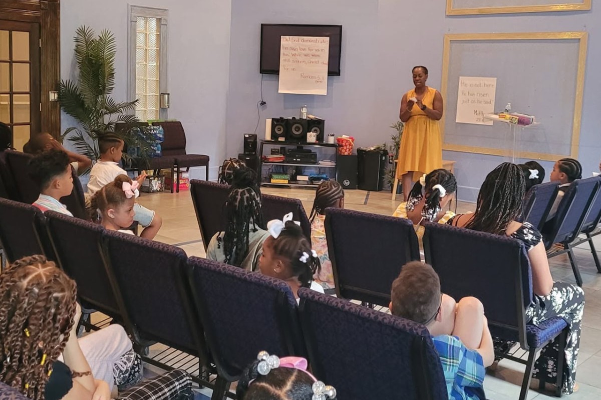 Pneuma Christian Academy teacher with a classroom of young children
